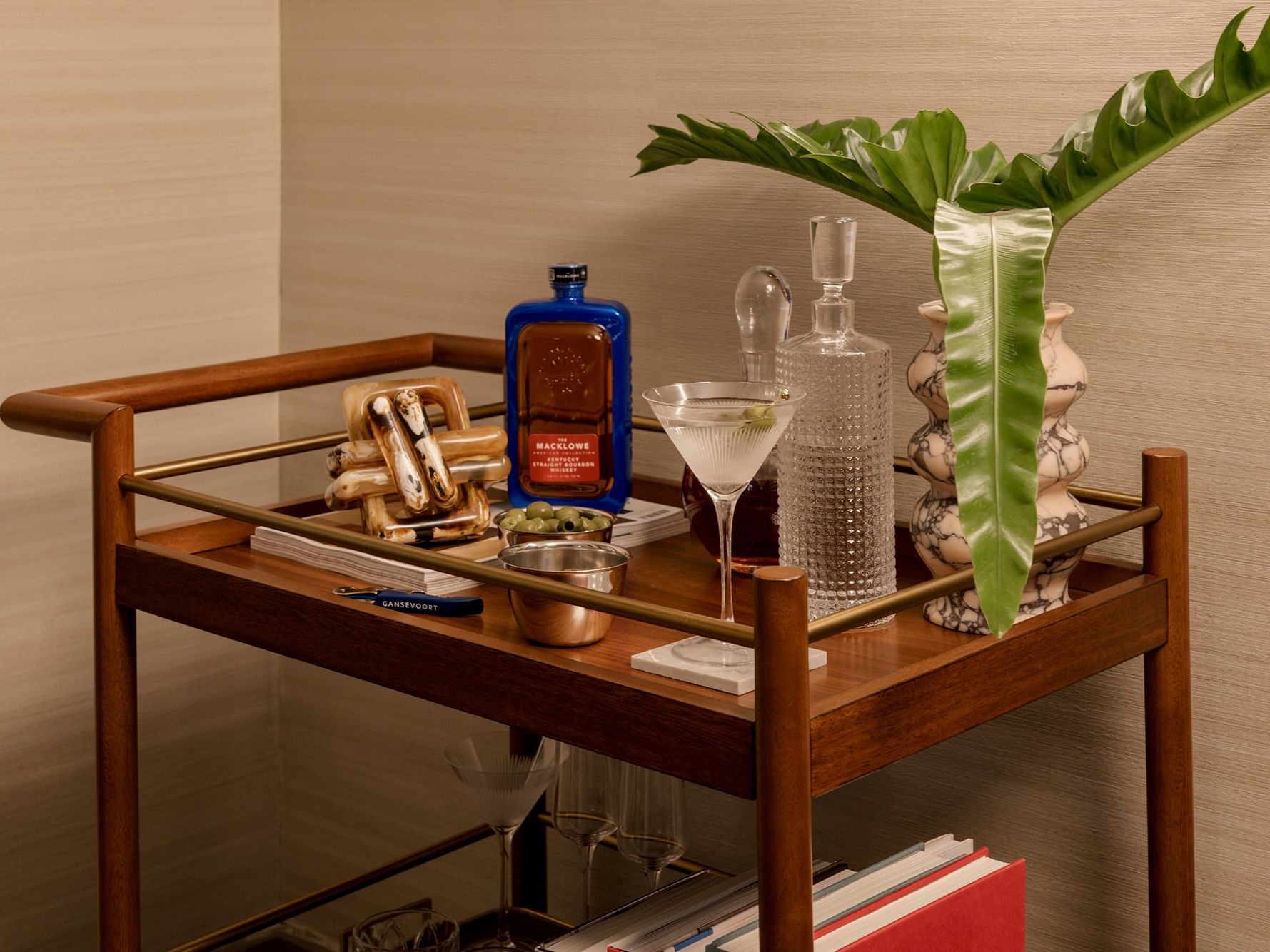 Bar cart with drinks and snacks in Gansevoort Suite at Gansevoort Meatpacking NYC in New York.