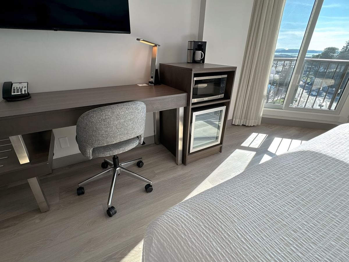 Hotel guestroom with work desk and a chair