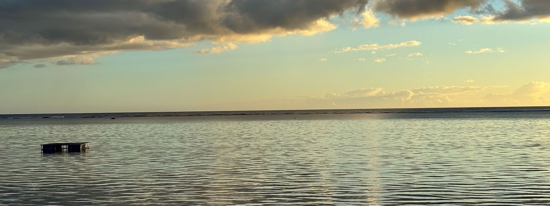 Calm ocean water with a distant horizon under a cloudy sky at Warwick Fiji Resort and Spa, Korolevu