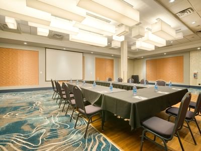 U-shape style meeting set-up and projeact screen at Matrix Hotel