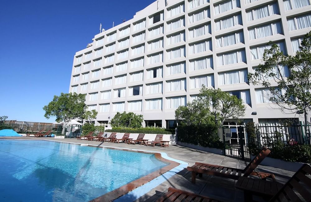 Sunbeds by the outdoor pool at Mercure Sydney Parramatta