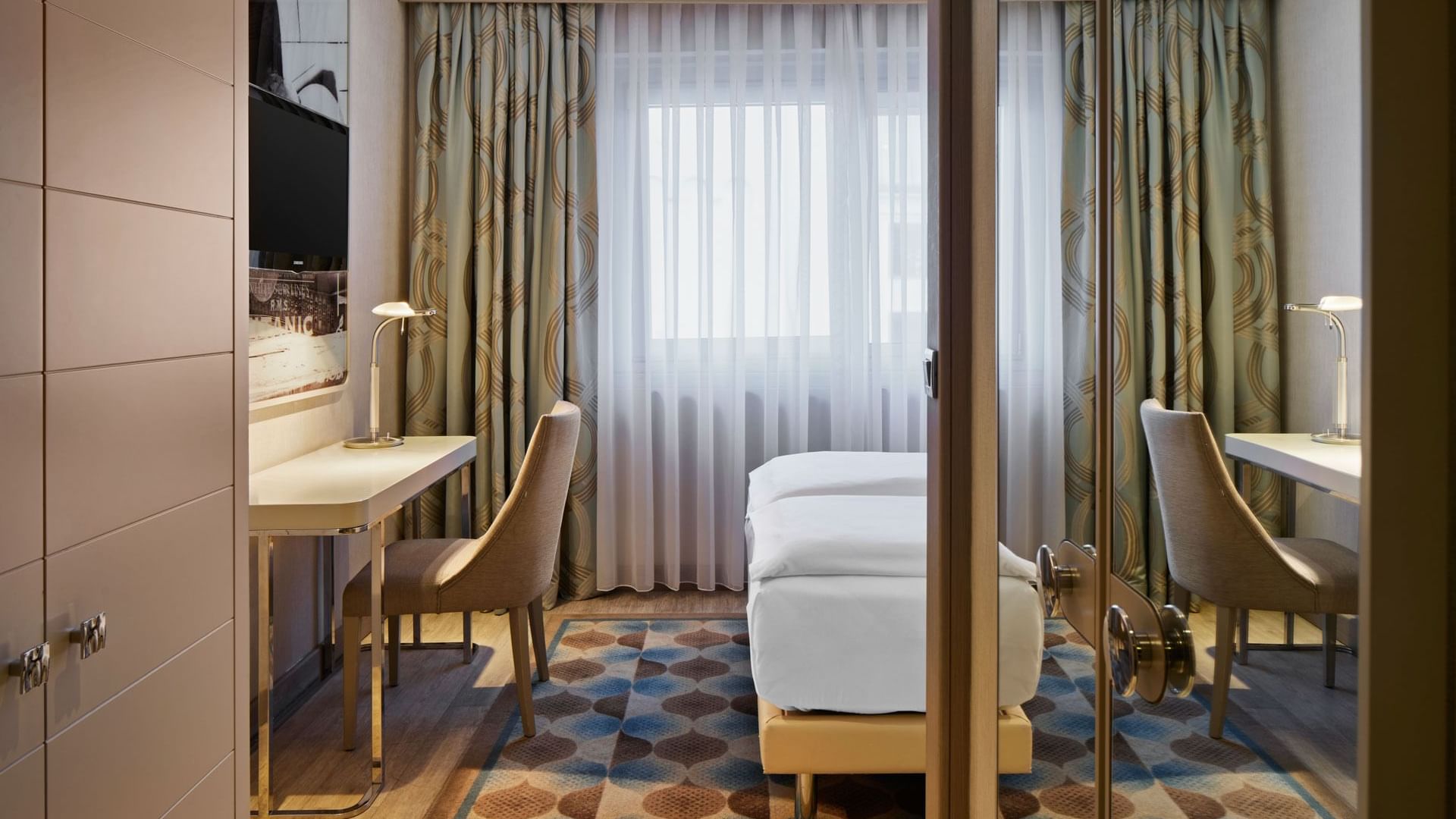 Separated bathroom and bedroom with work area in Superior Room at Titanic Comfort Mitte