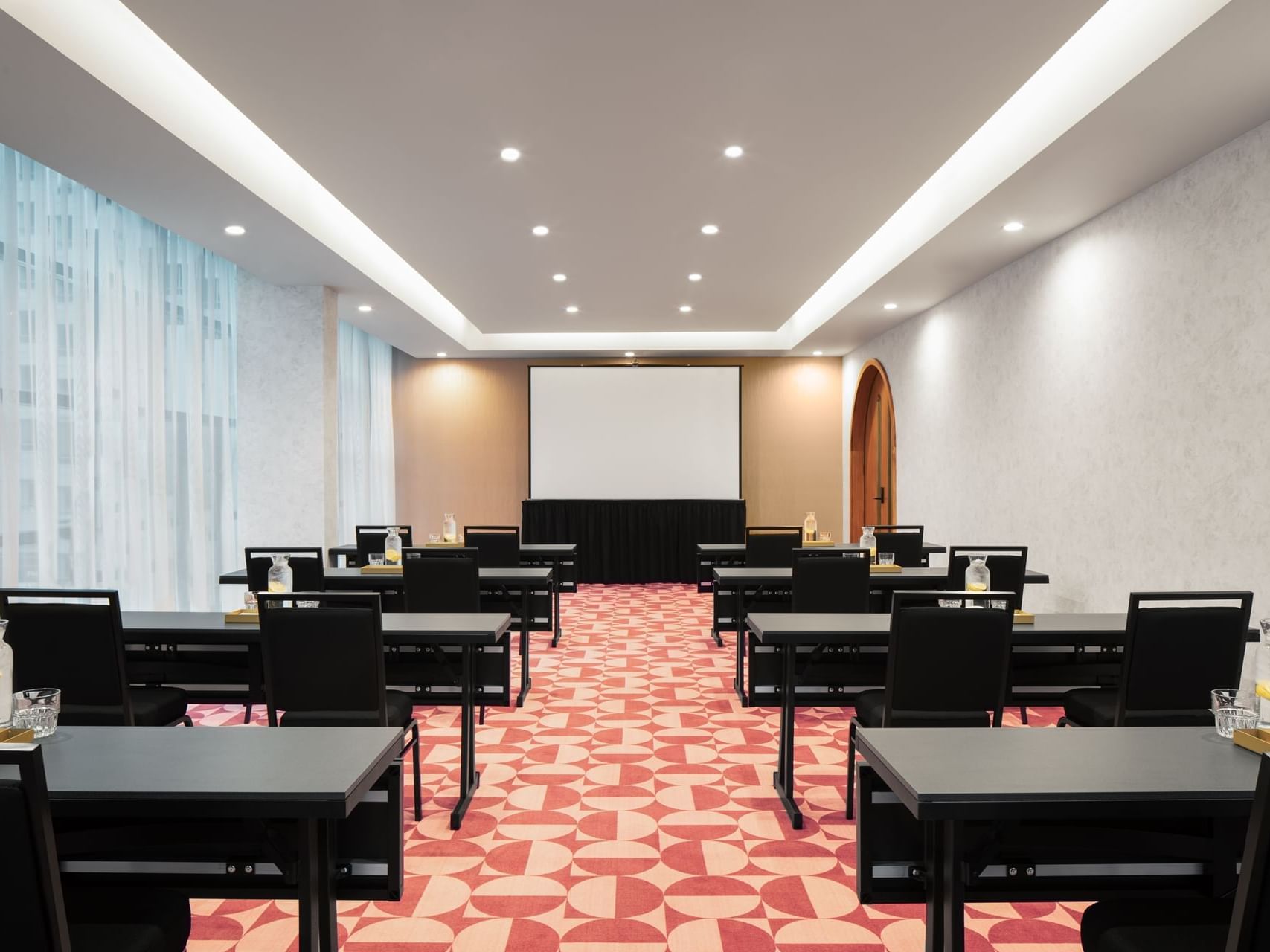 Classroom-type table set-up in Kiki at Honeyrose Hotel