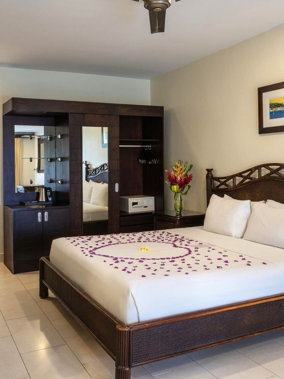 Purple petal heart on the bed and side wooden mirror in Garden View Room at warwick le lagon-vanuatu