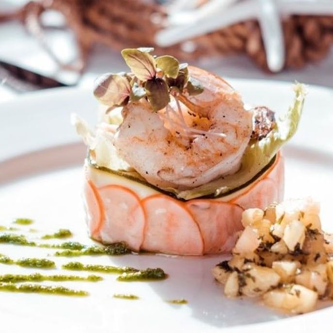 Gourmet seafood tower with fresh shrimp and microgreens for Themed Buffet Dinners at Sugar Cane Club Hotel & Spa