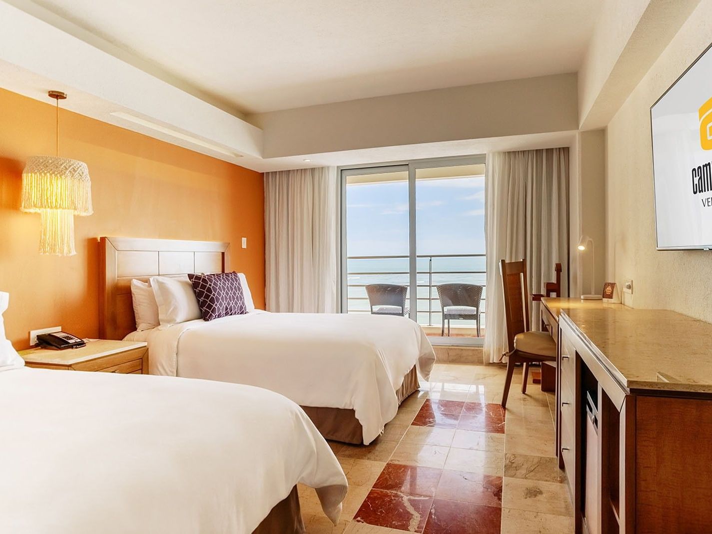 2 Double Deluxe Superior room with wooden furniture and a private balcony overlooking the sea at Camino Real Veracruz