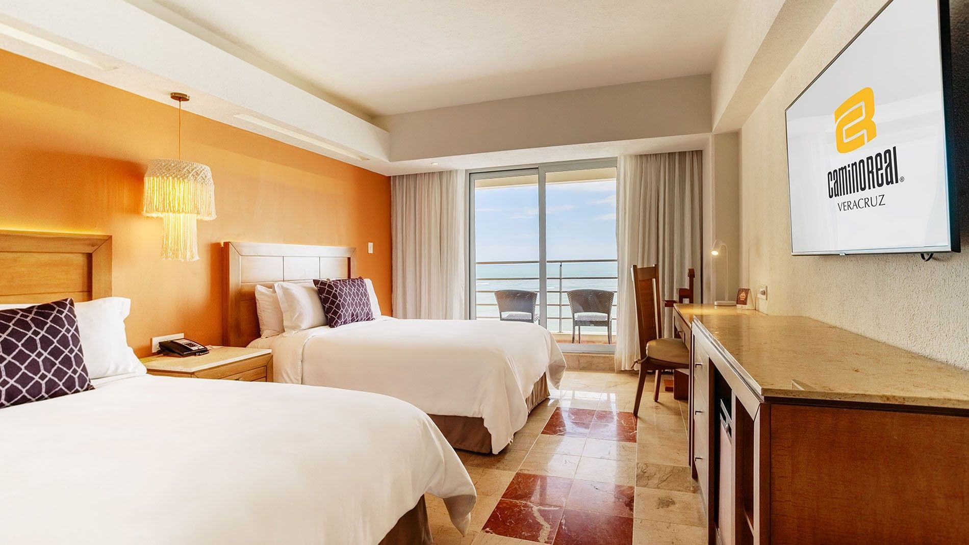 2 Double Deluxe Superior room with wooden furniture and a private balcony overlooking the sea at Camino Real Veracruz