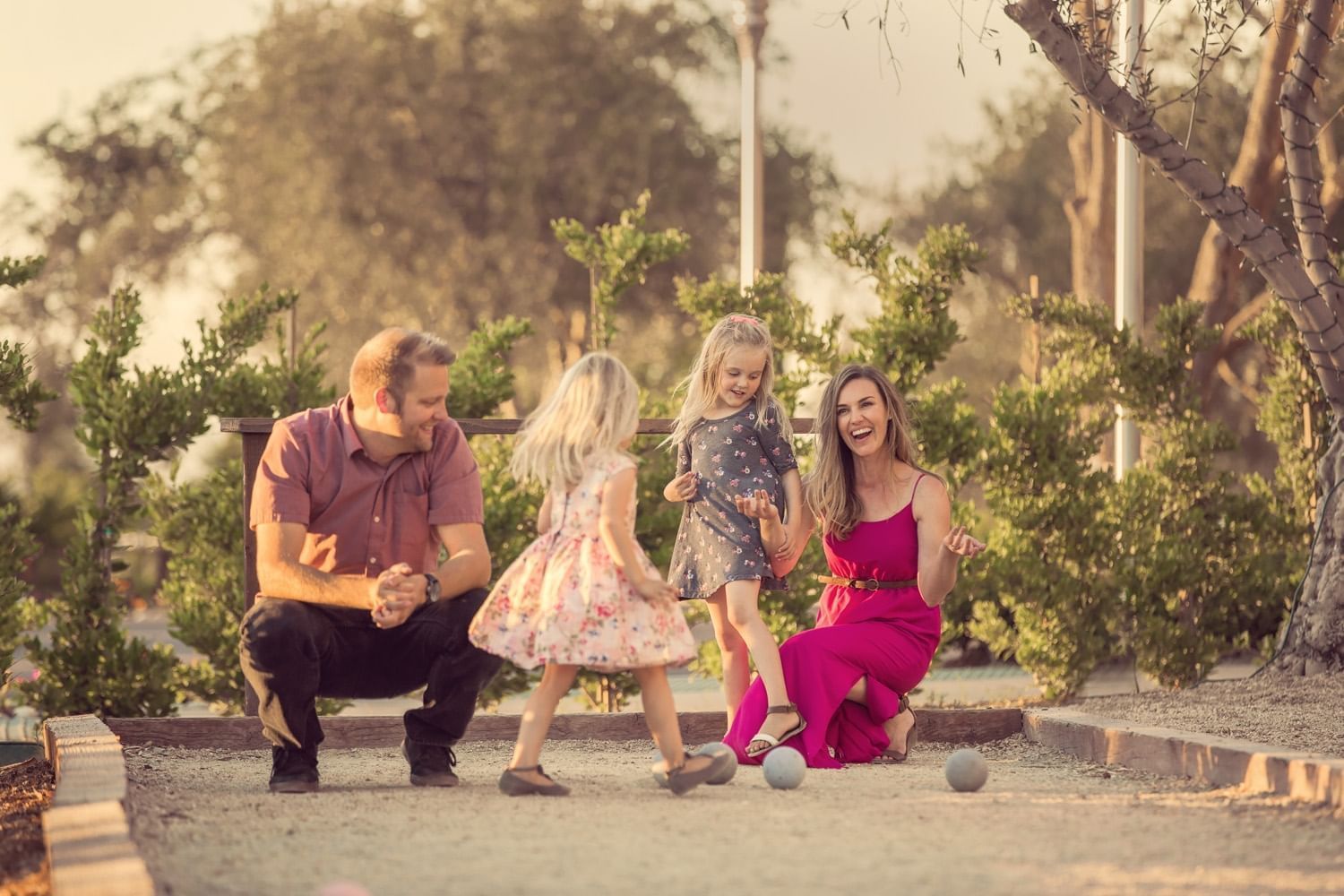 Family playing on the bocce ball court