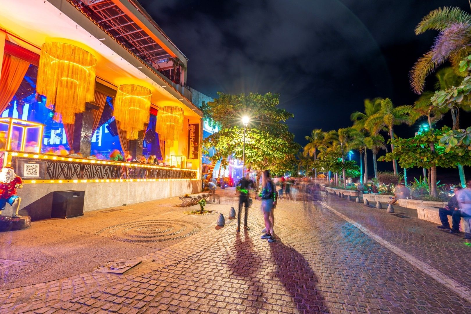 Puerto Vallarta Malecón at night with people walking