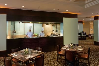 Chefs preparing meals in White Rose Cafe at York Hotel