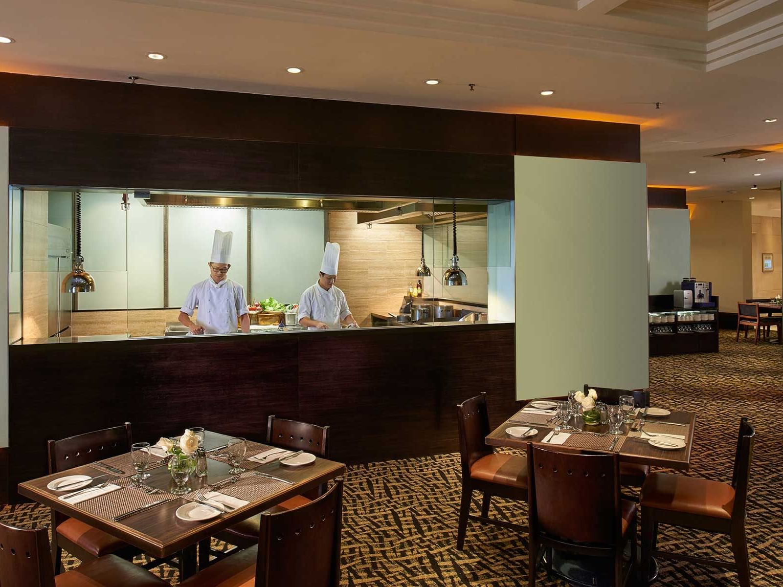 Chefs preparing meals in White Rose Cafe at York Hotel