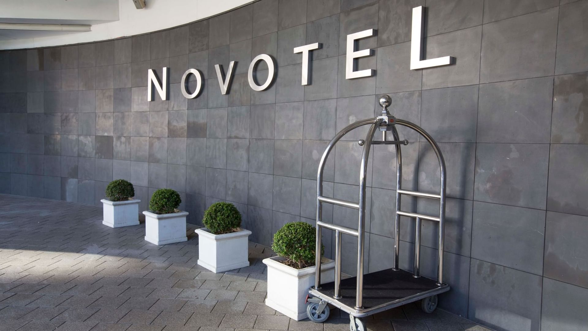 Birdcage Luggage Cart by the entrance at Novotel Olympic Park