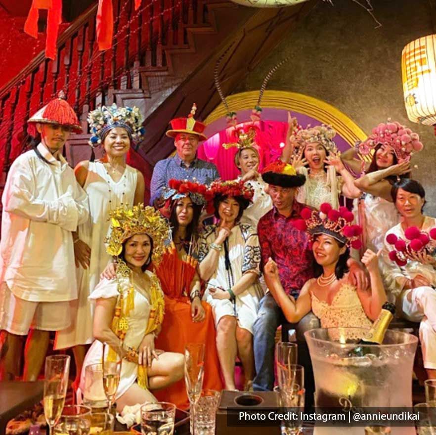 A group of people styled in Qing Dynasty Manchurian headwear in Manchu bar - Lexis Suites Penang