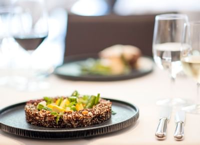 Close-up of a dish served with wine at Hotel Sternen Oerlikon
