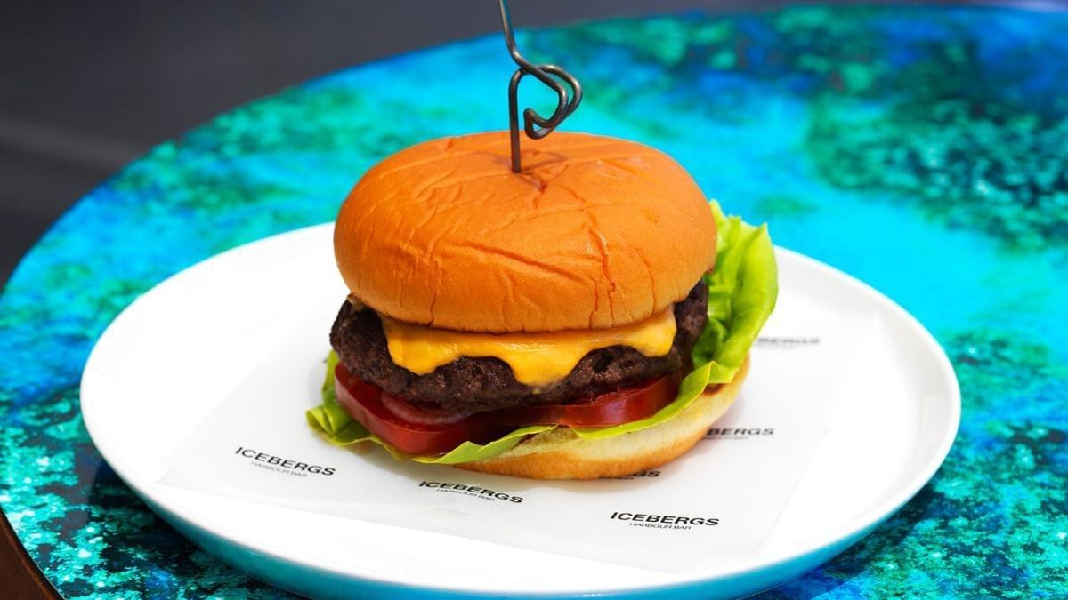 Cheeseburger served on a plate in Icebergs Harbour Bar at Crown Hotels