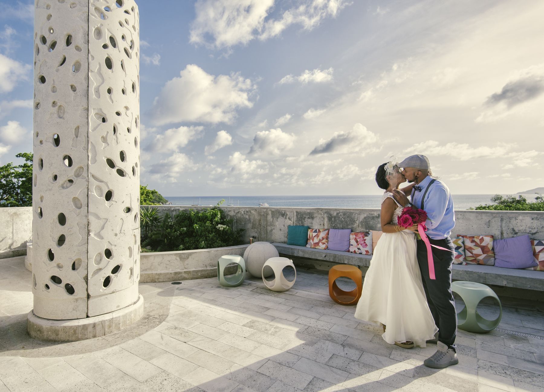 Groom & Bride kissing in the roof top at El Blok Hotel 