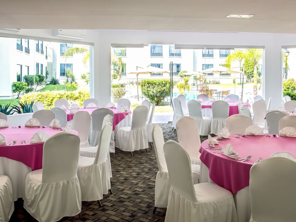 Banquet table setup in an event room at Fiesta Inn Hotels