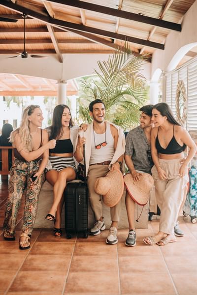 Friends enjoying by the hotel lobby at Playa Blanca Beach Resort