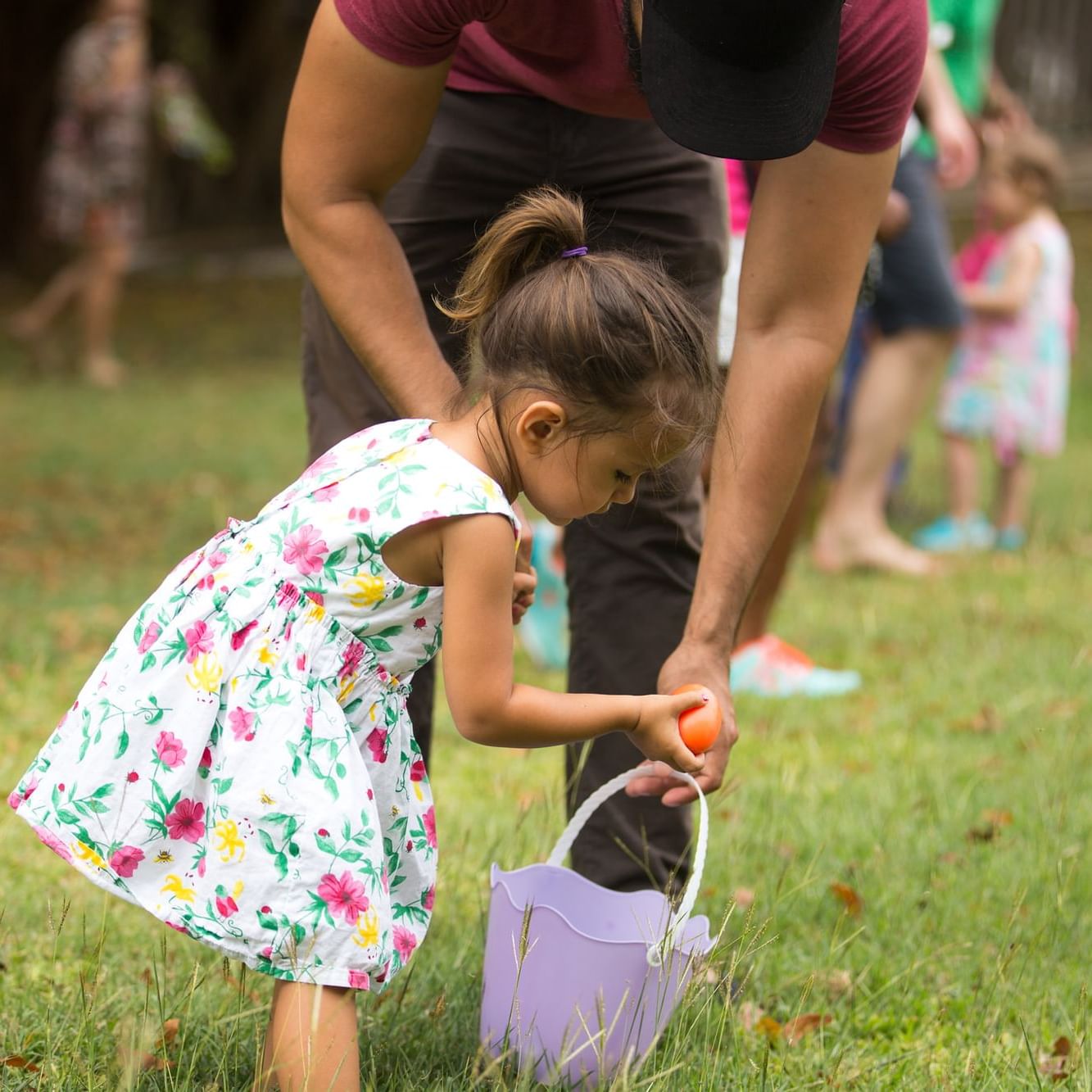 Father & daughter finding Easter eggs at True Blue Bay Resort