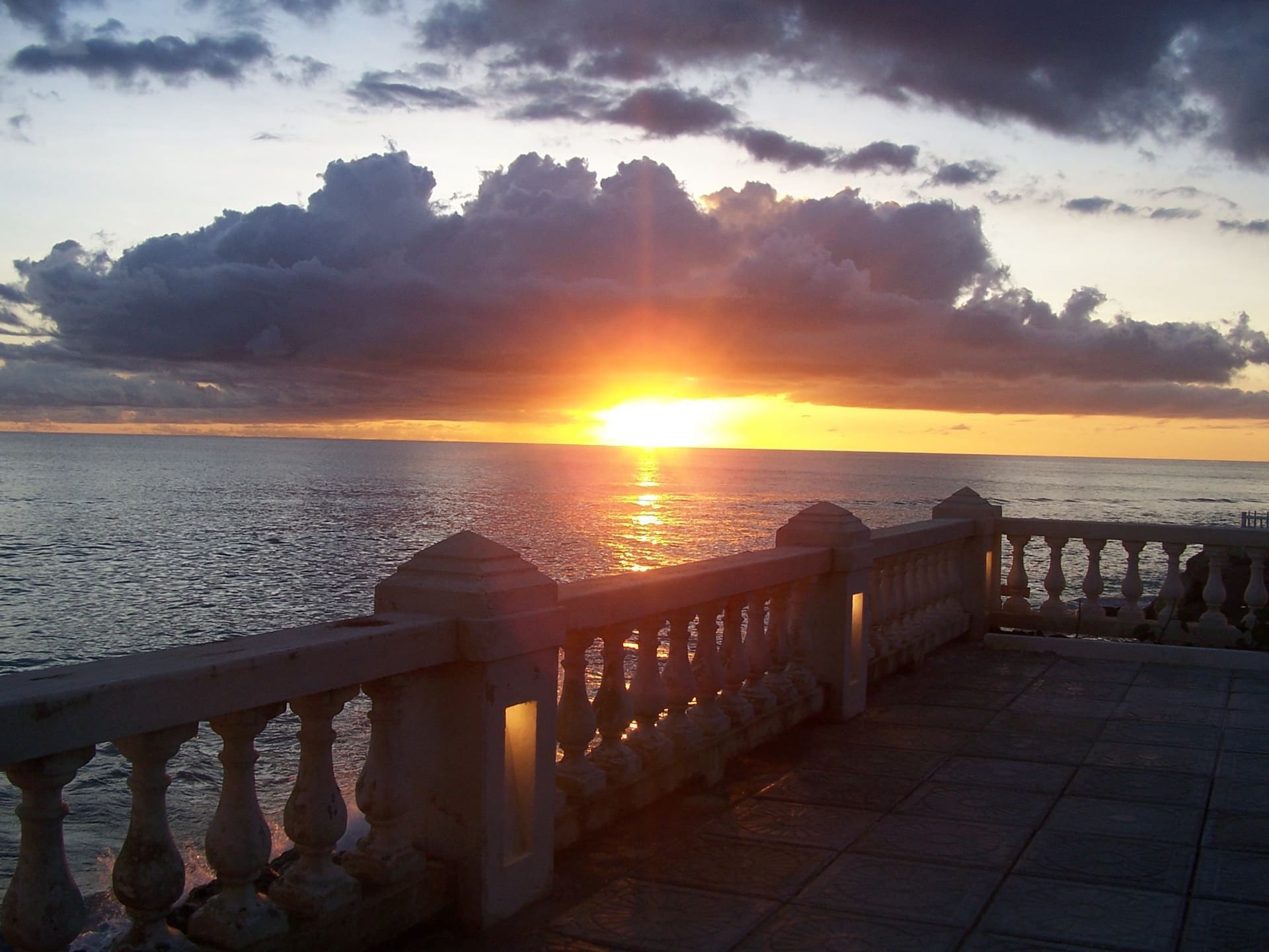 Serene sunset over the ocean, captured from terrace at Dover Beach Hotel