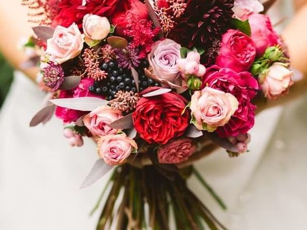 Vibrant bridal bouquet with deep red and blush pink roses for a wedding at The Sebel Mandurah