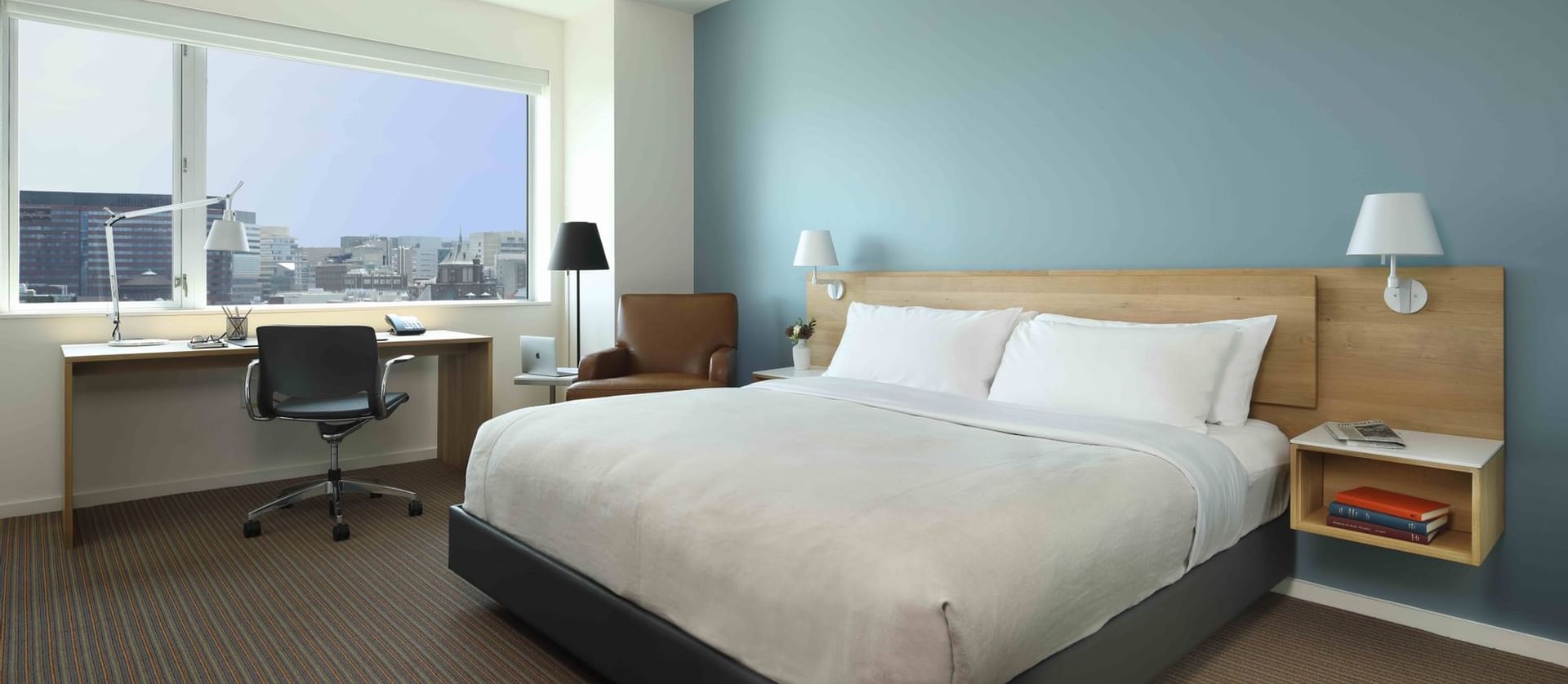 Cozy bed overlooking the city in King Room at The Study at University City