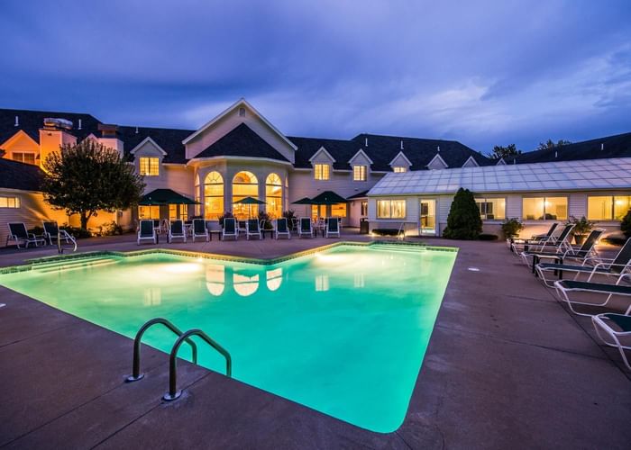 Exterior of the hotel and outdoor pool with pool beds at Gorges Grant Hotel by Ogunquit Collection