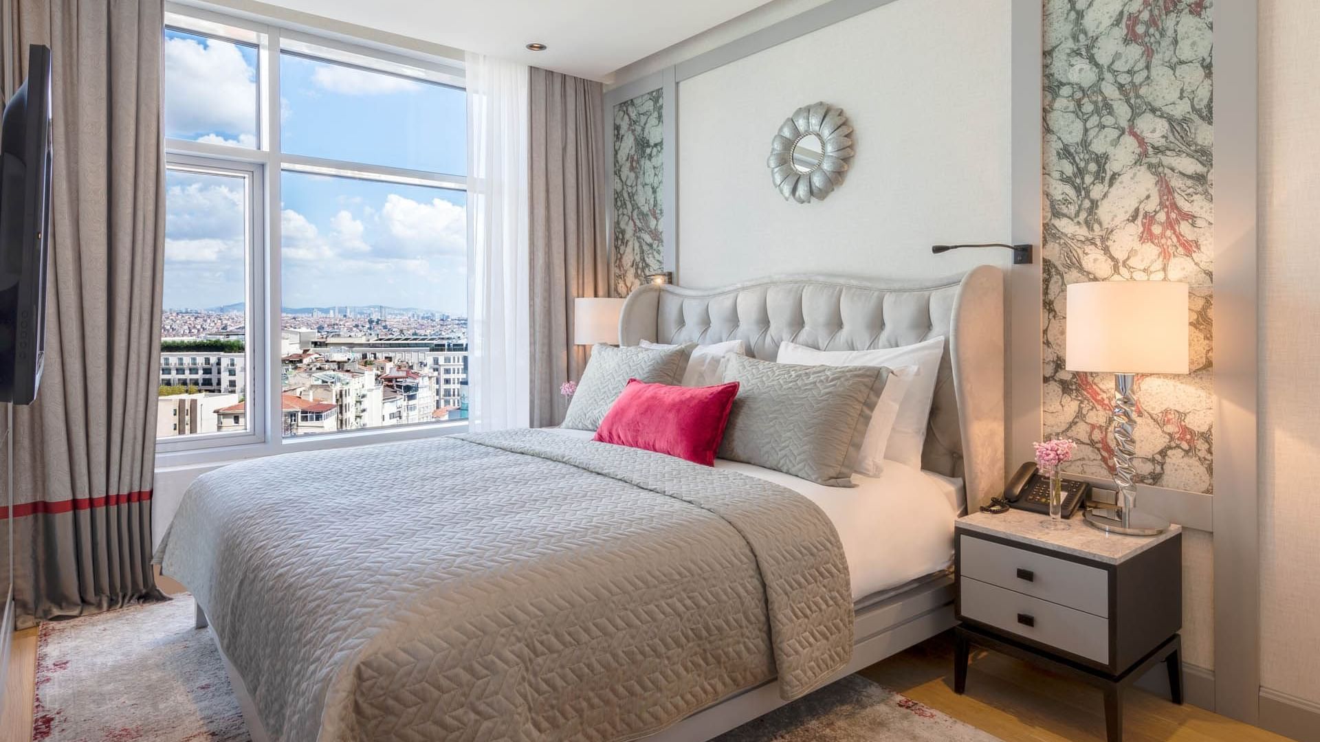 King bed in Taksim Suite with city view at CVK Taksim Hotel Istanbul