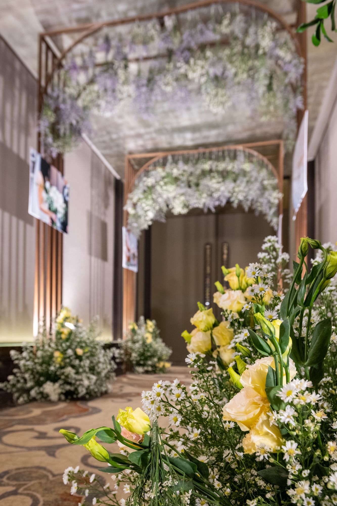 A meeting hall with flower decorations at Okura Prestige