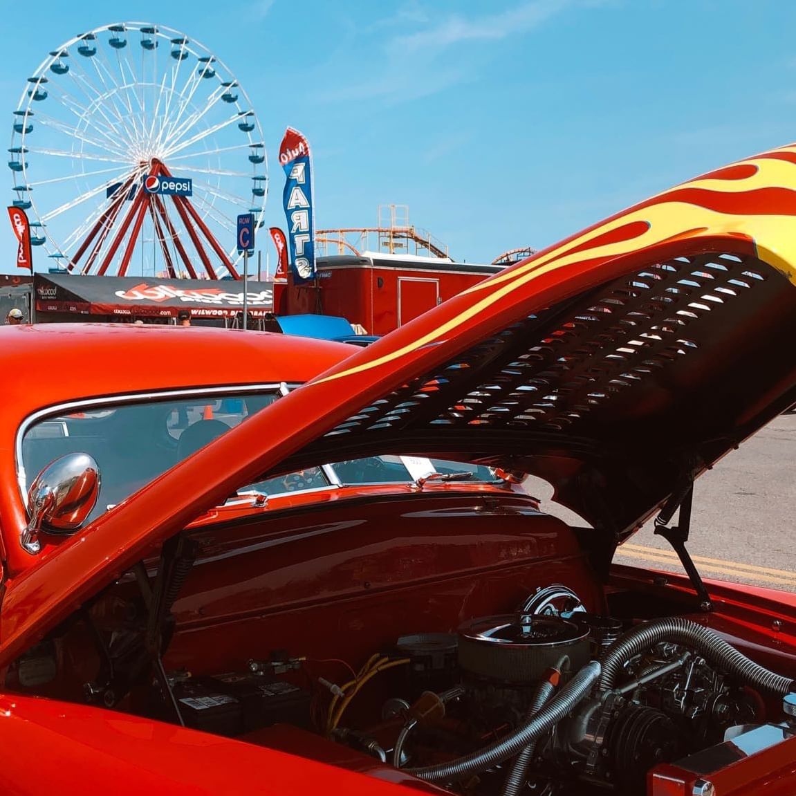 hot rod in front of ferris wheel