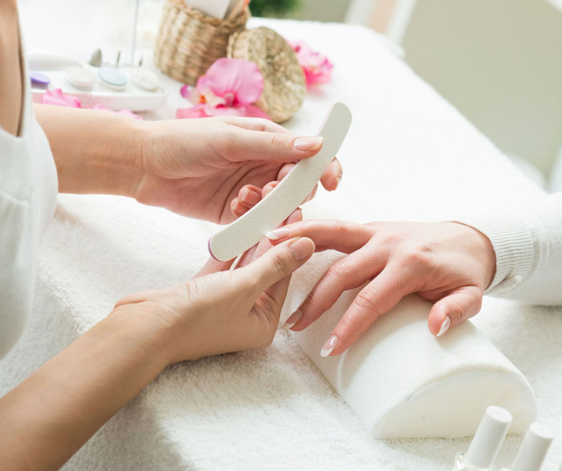 Nail technician filing nails at the spa at Shangri-La Monkey Island, hand resting comfortably