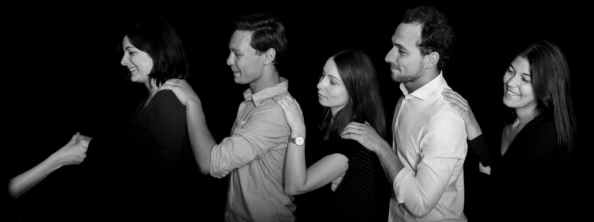 Peoples in a row holding each other at Warwick Brussels