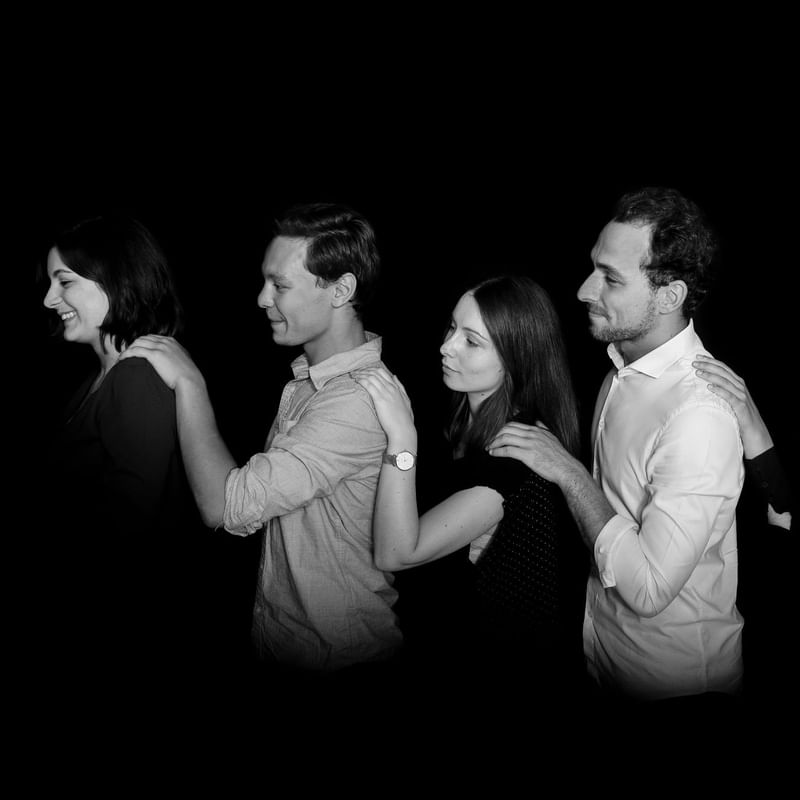 Peoples in a row holding each other at Warwick Brussels