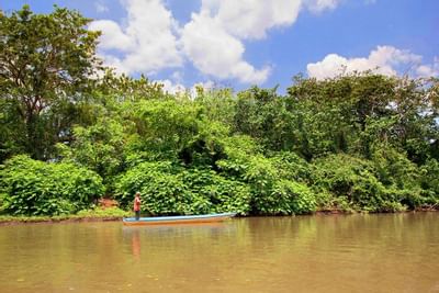 Man on boat near the Rio Celeste Hideaway