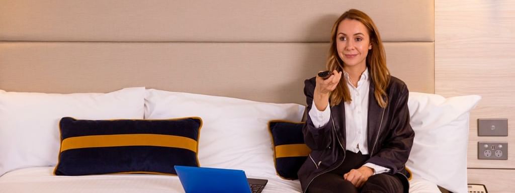 Guest in standard room bed