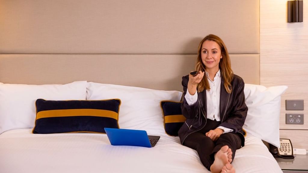 Guest in standard room bed