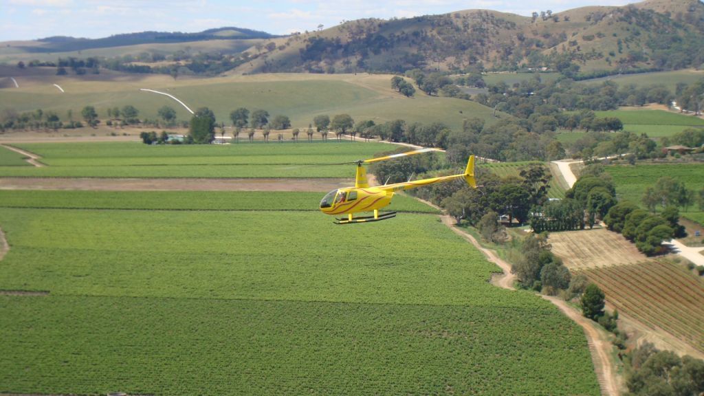 Helicopter flying with passengers near Novotel Barossa Valley