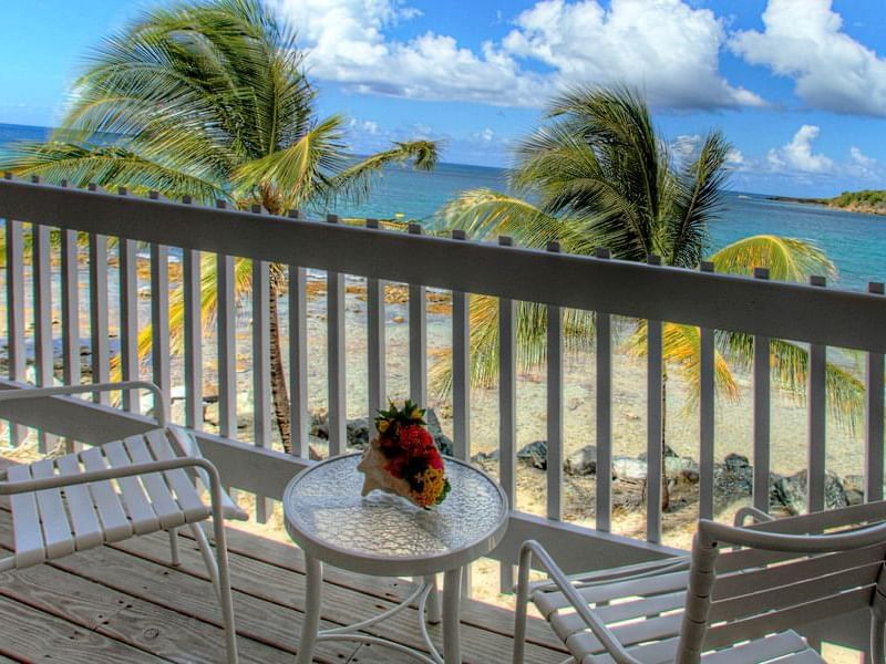 Room balcony with the view of beach at Tamarind Reef Resort