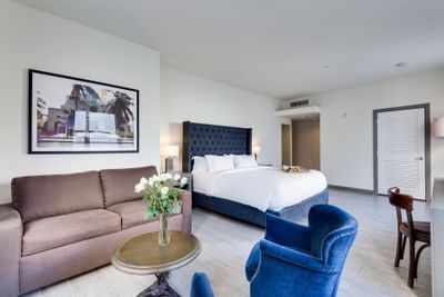 Bedroom & living area in Deluxe King at Clinton Hotel South 