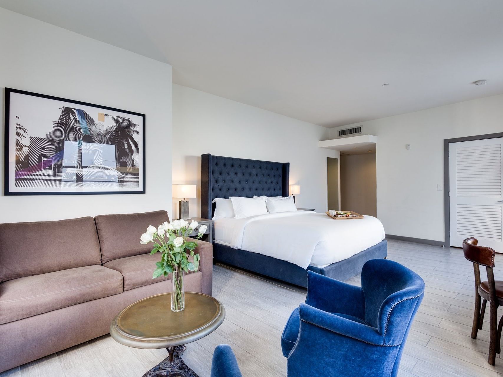 Bedroom & living area in Deluxe King at Clinton Hotel South