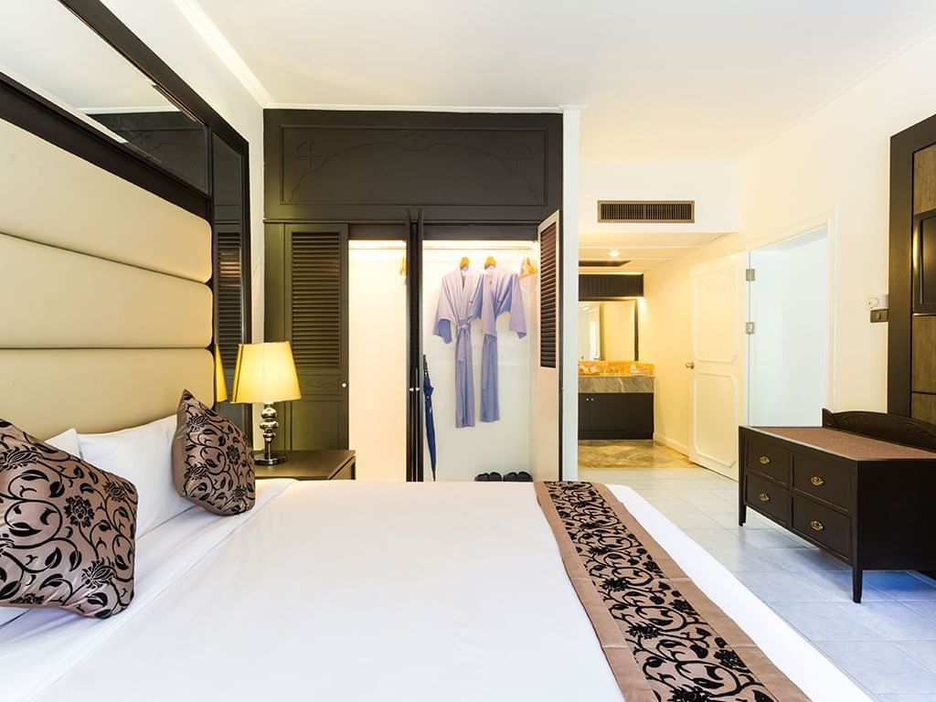 Bed by the wardrobe in Casuarina Suite at Amora Hotel