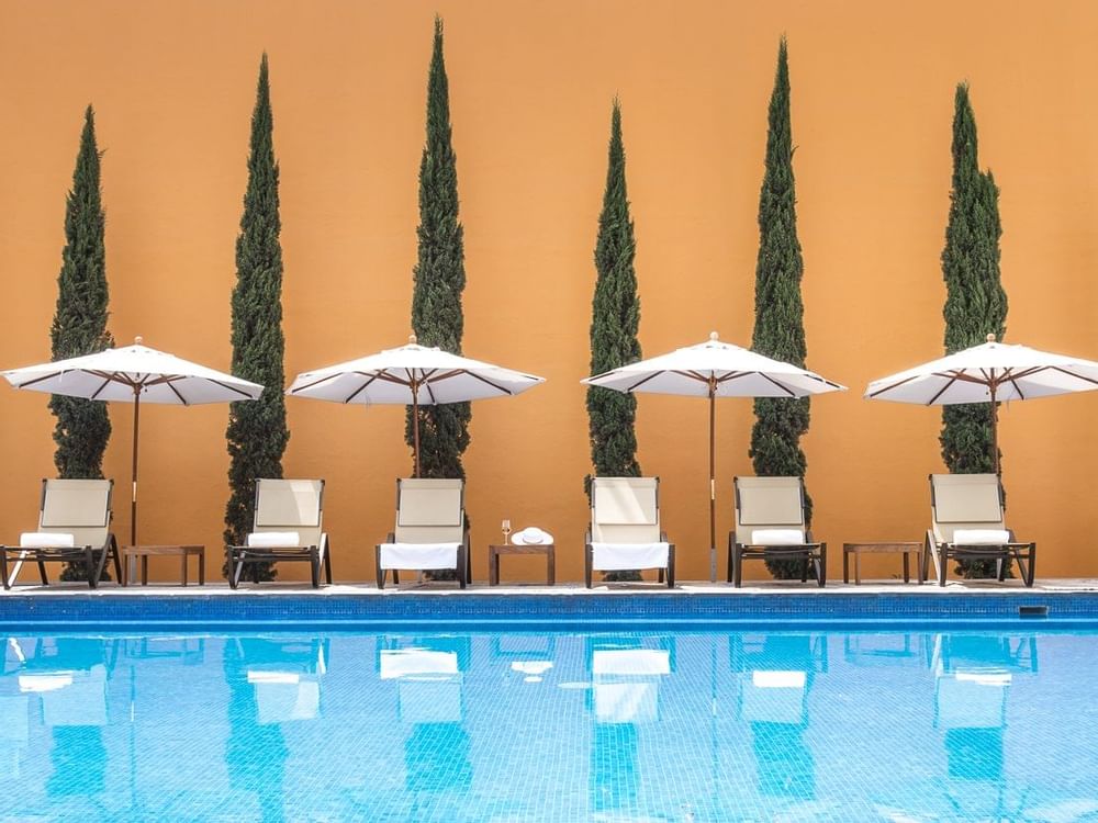 Outdoor pool with pool beds at Grand Fiesta Americana Queretaro