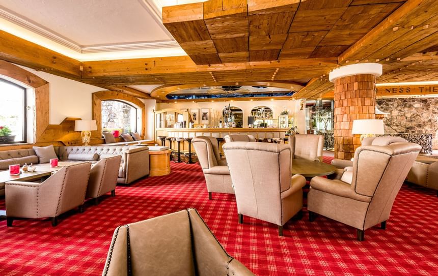 The lounge and bar is filled with comfortable chairs and tables 