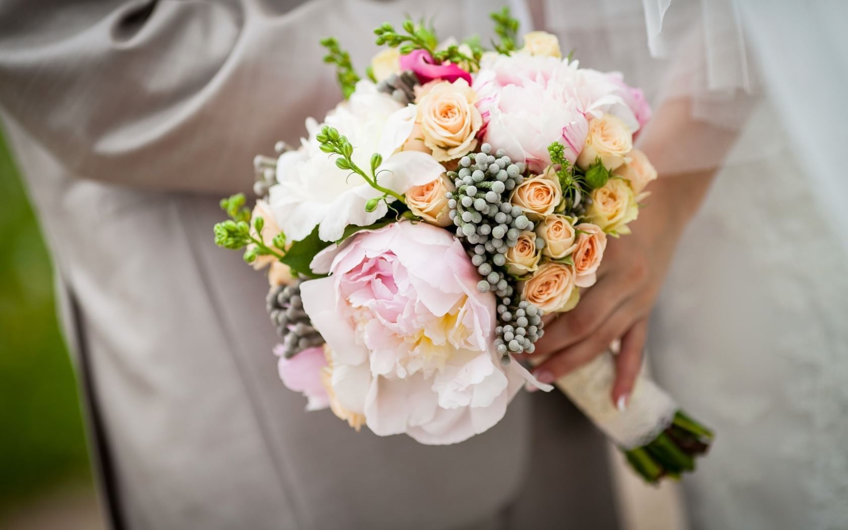 Bride holding a wedding flower bouquet at Eastin Grand Hotel Saigon