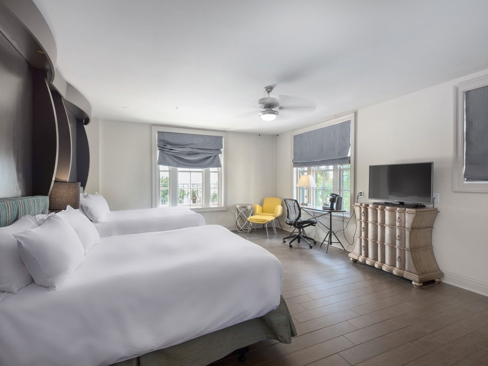 Accessible Two Queen Beds Gulf View with queen beds, a yellow chair, and a desk by the window at The White House Hotel