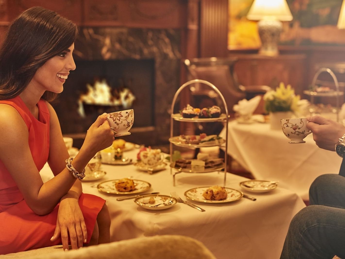 Couple having high tea by a fireplace at The Townsend Hotel