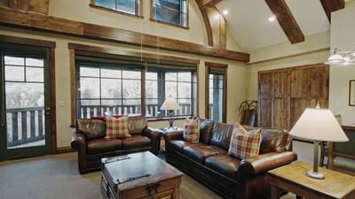 Lounge area with plush seating by the windows letting the natural light at Hotel Park City Autograph Collection