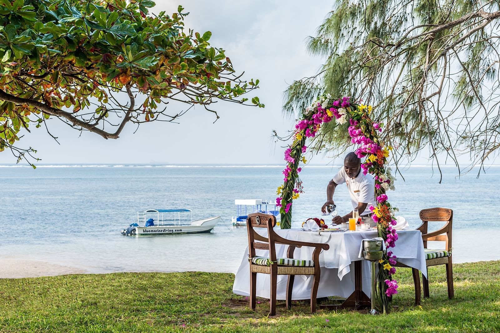 Staff organizing a honeymoon meal at Serena Beach Resort & Spa