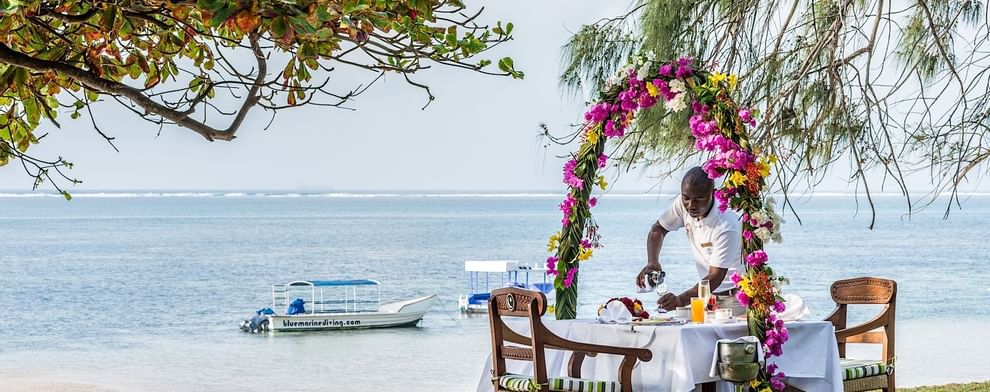 Staff organizing a honeymoon meal at Serena Beach Resort & Spa