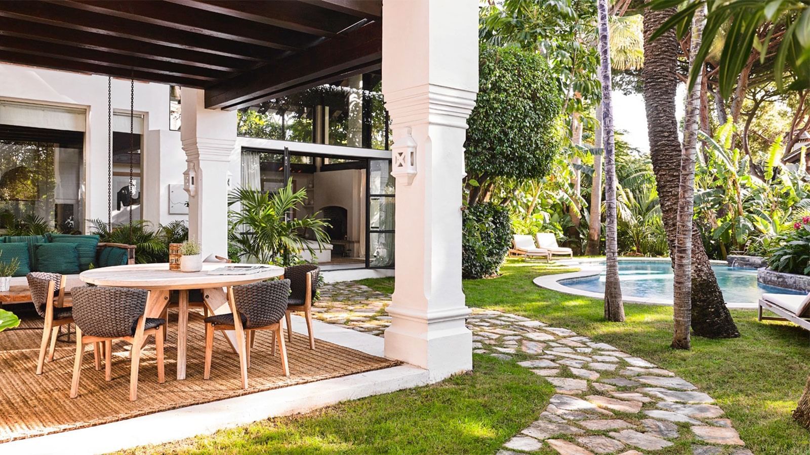 Outdoor dining by the pool in Bel Air at Marbella Club
